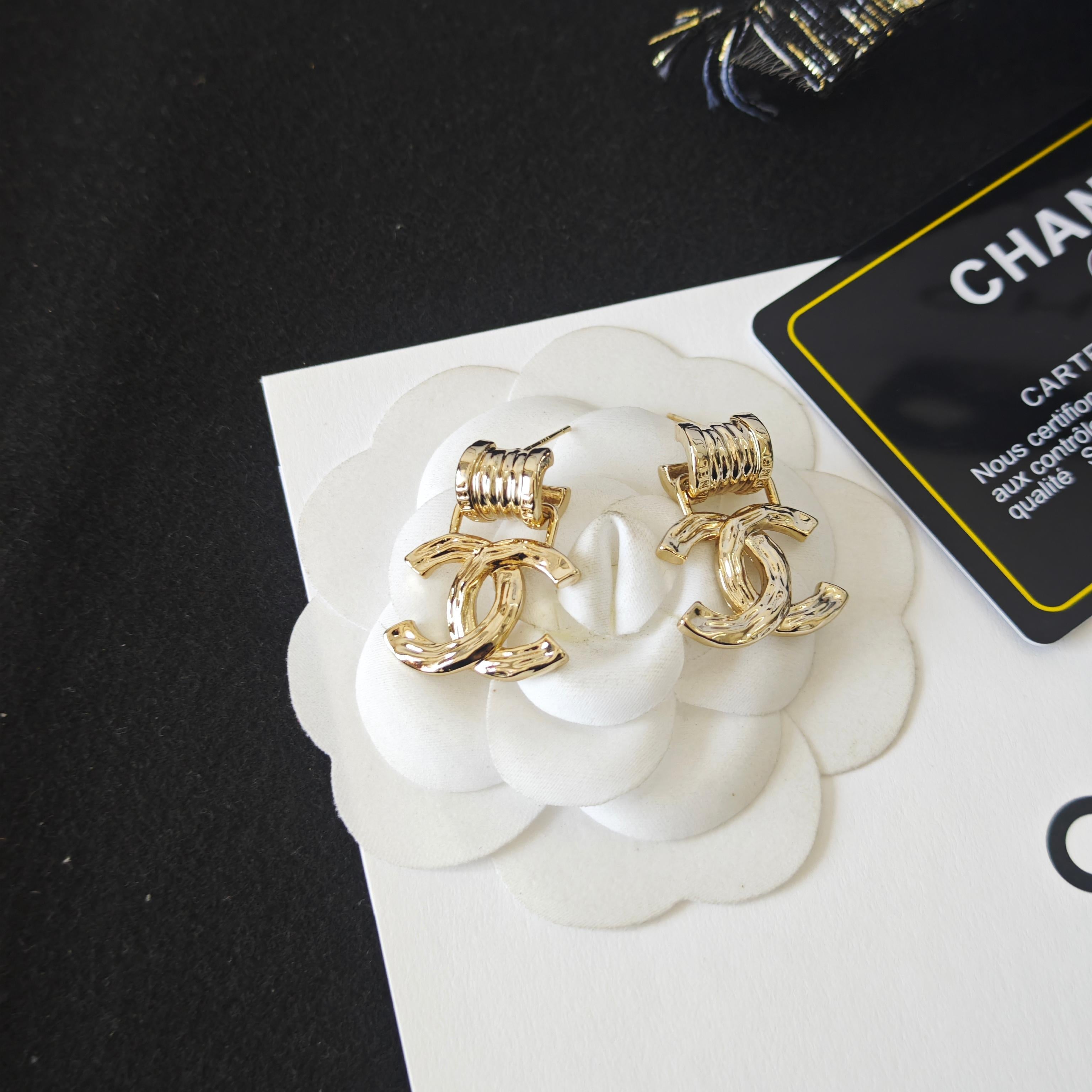 Intricately Carved Spring Letter Earrings