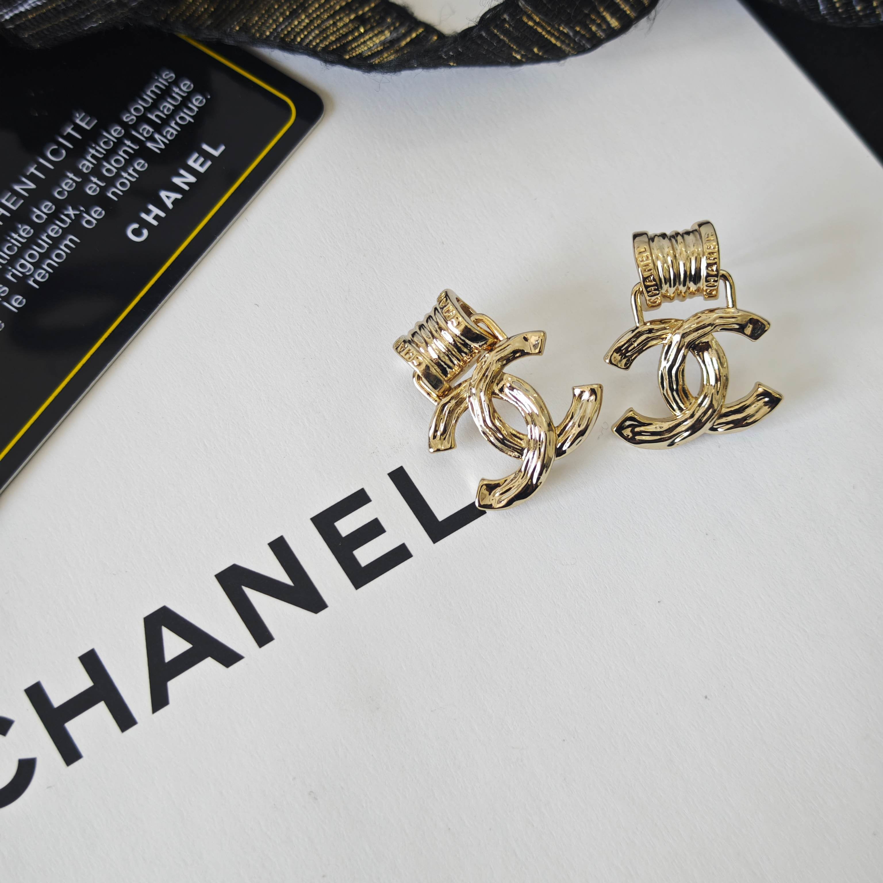 Intricately Carved Spring Letter Earrings