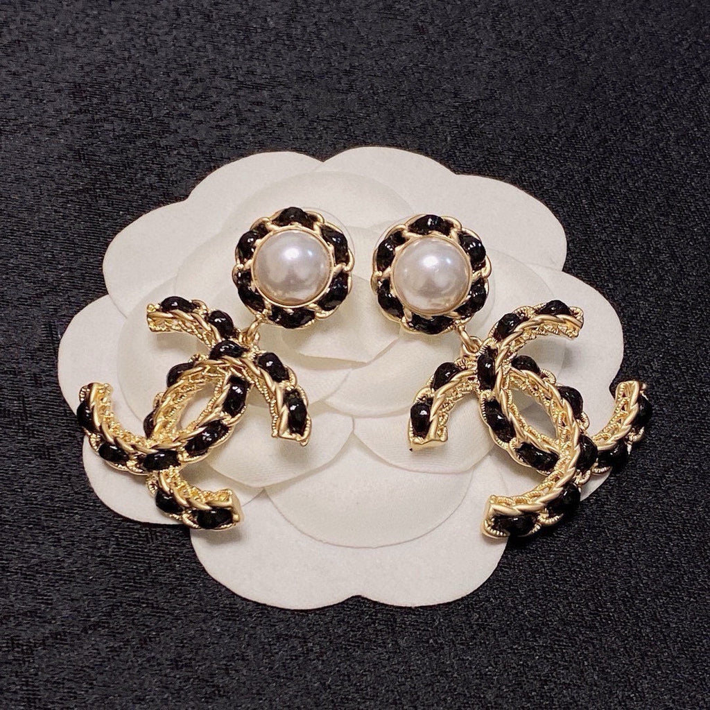 Black leather pearl earrings