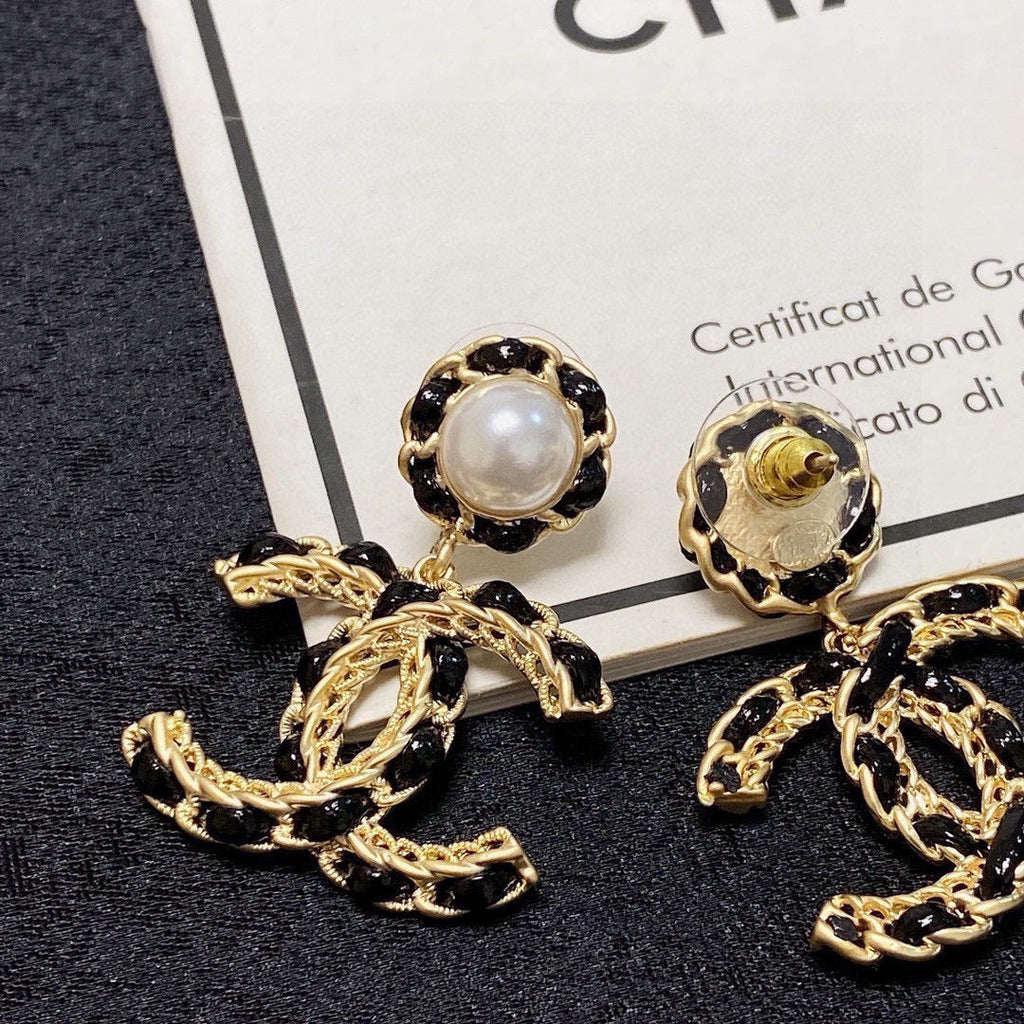 Black leather pearl earrings