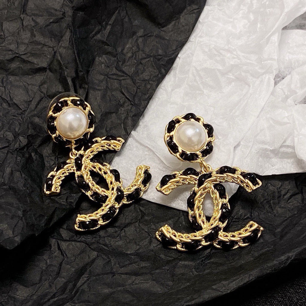 Black leather pearl earrings