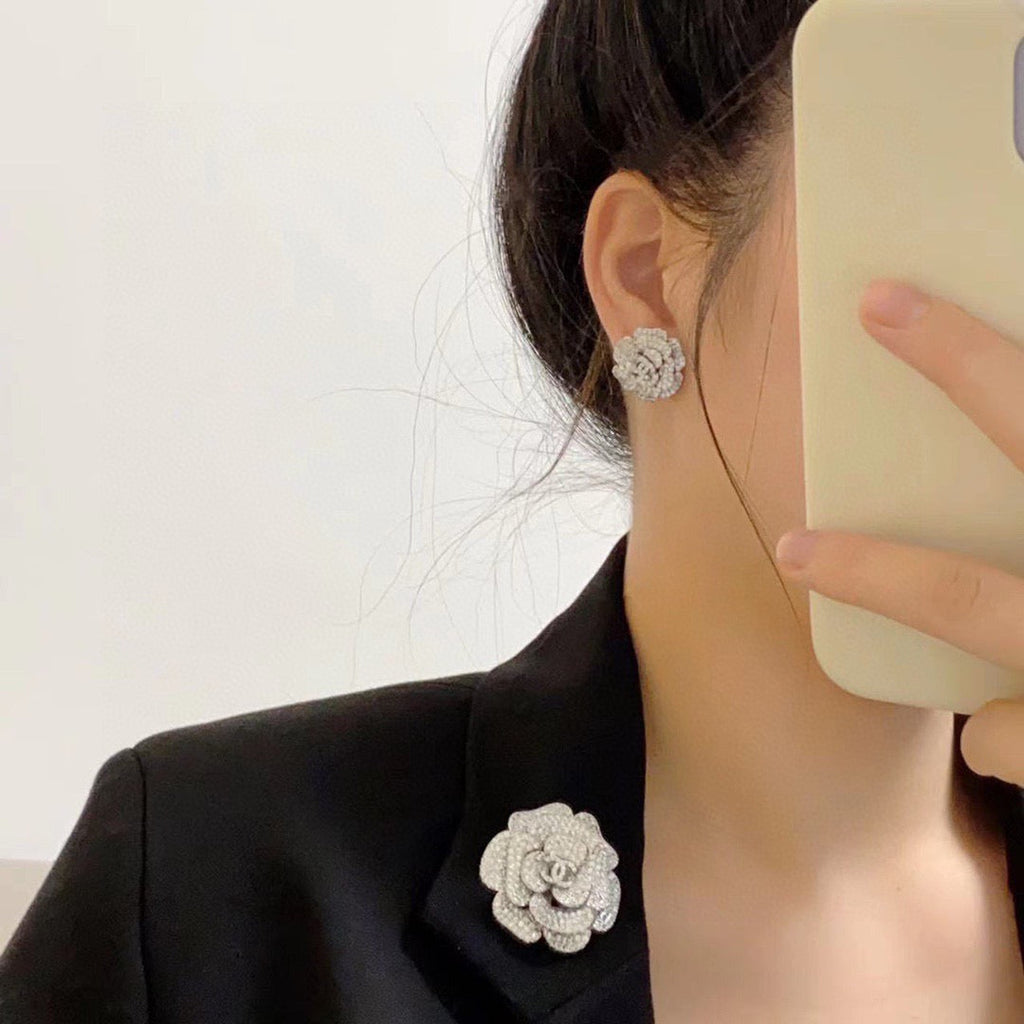Silver camellia stud earrings with full diamonds