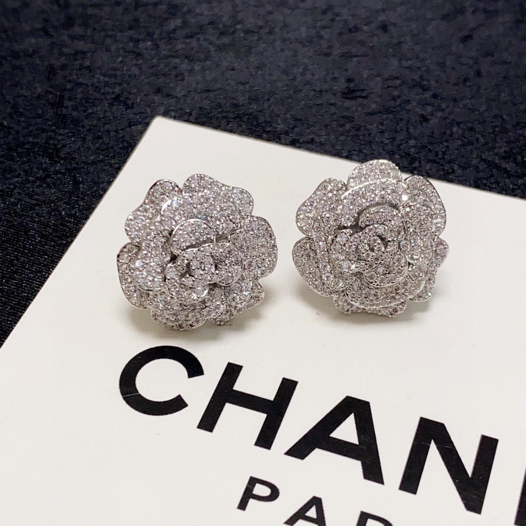 Silver camellia stud earrings with full diamonds