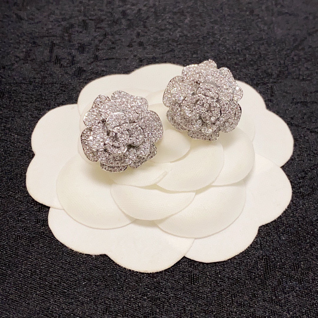 Silver camellia stud earrings with full diamonds