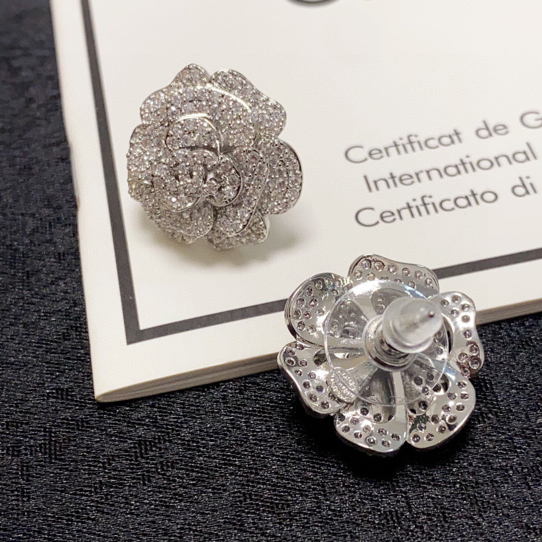 Silver camellia stud earrings with full diamonds