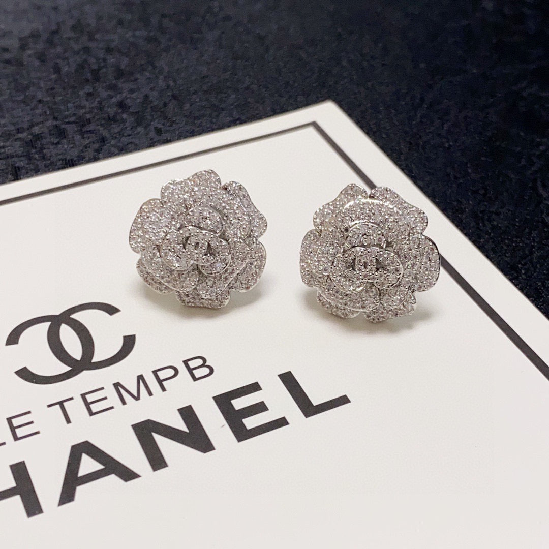 Silver camellia stud earrings with full diamonds