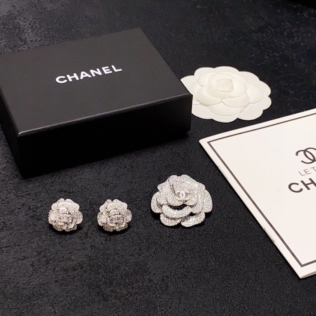 Silver camellia stud earrings with full diamonds
