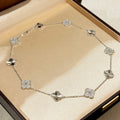 Laser-cut four-leaf clover necklace with interspersed diamonds and ten flowers