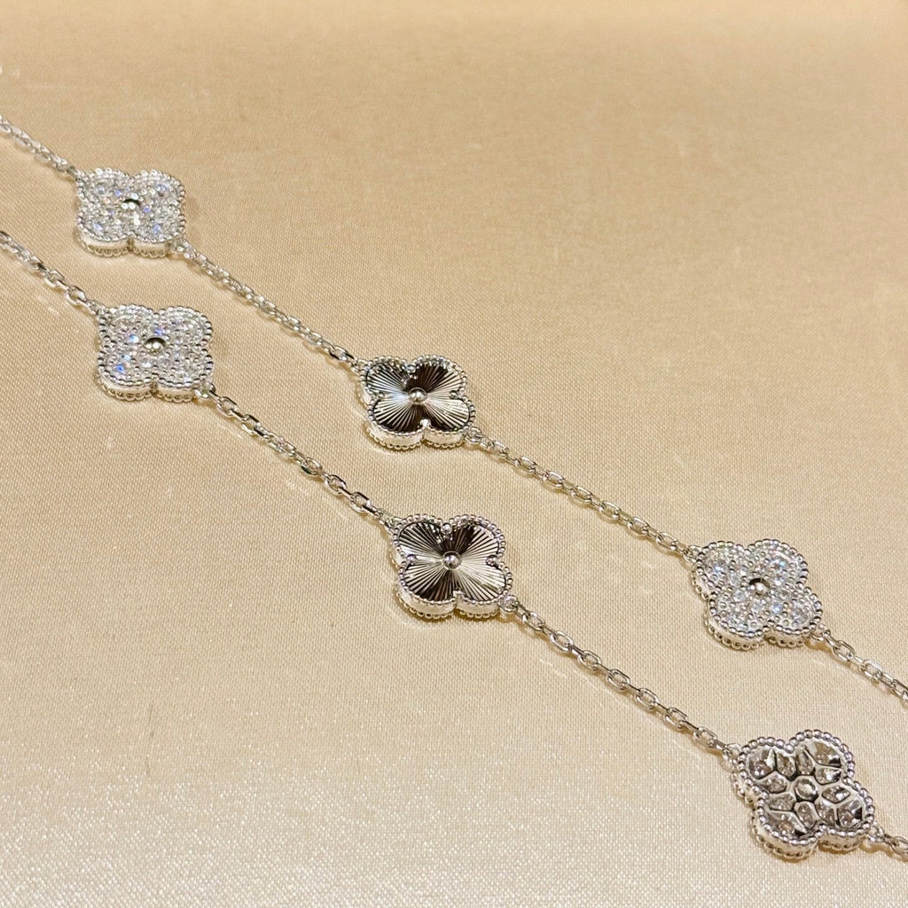 Laser-cut four-leaf clover necklace with interspersed diamonds and ten flowers