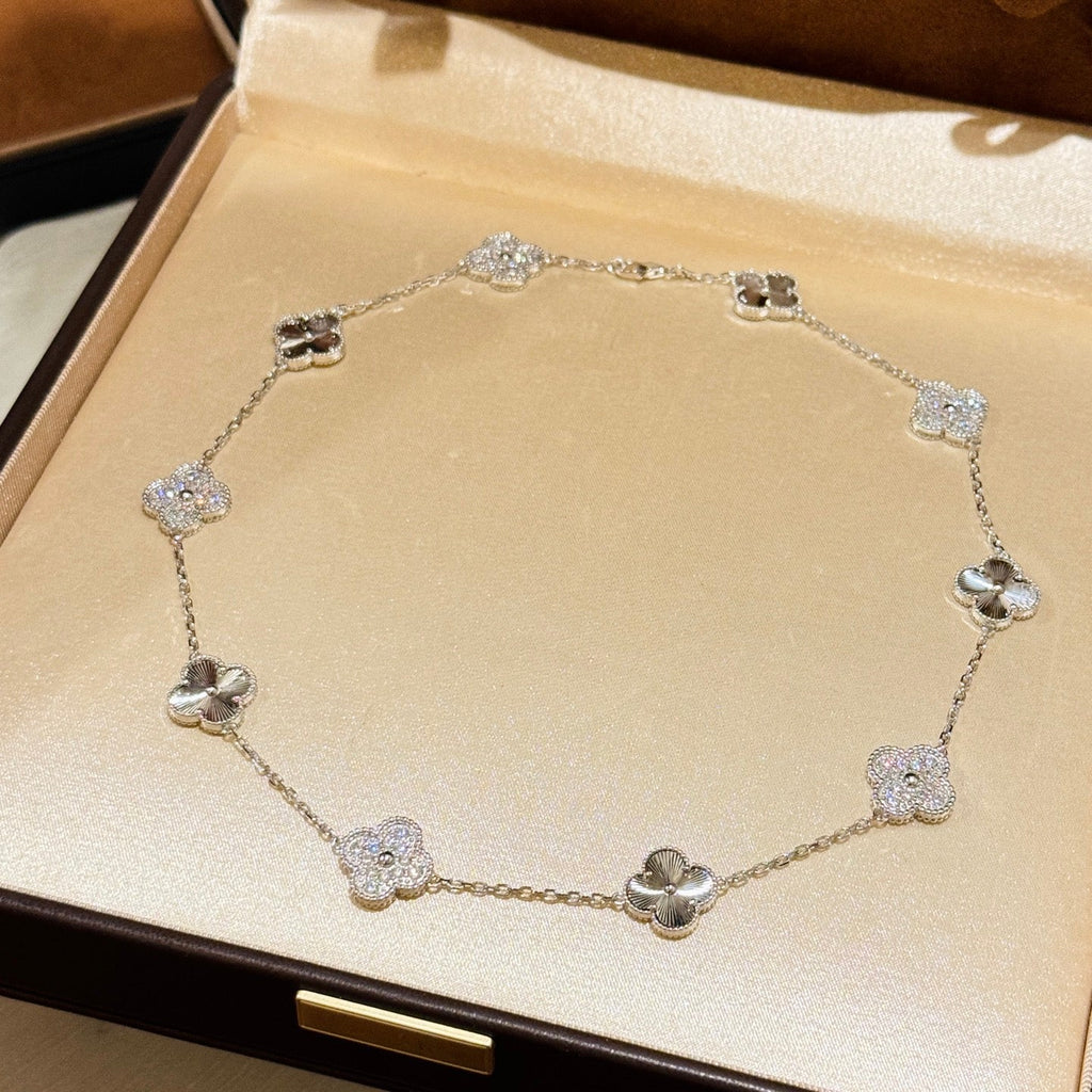 Laser-cut four-leaf clover necklace with interspersed diamonds and ten flowers