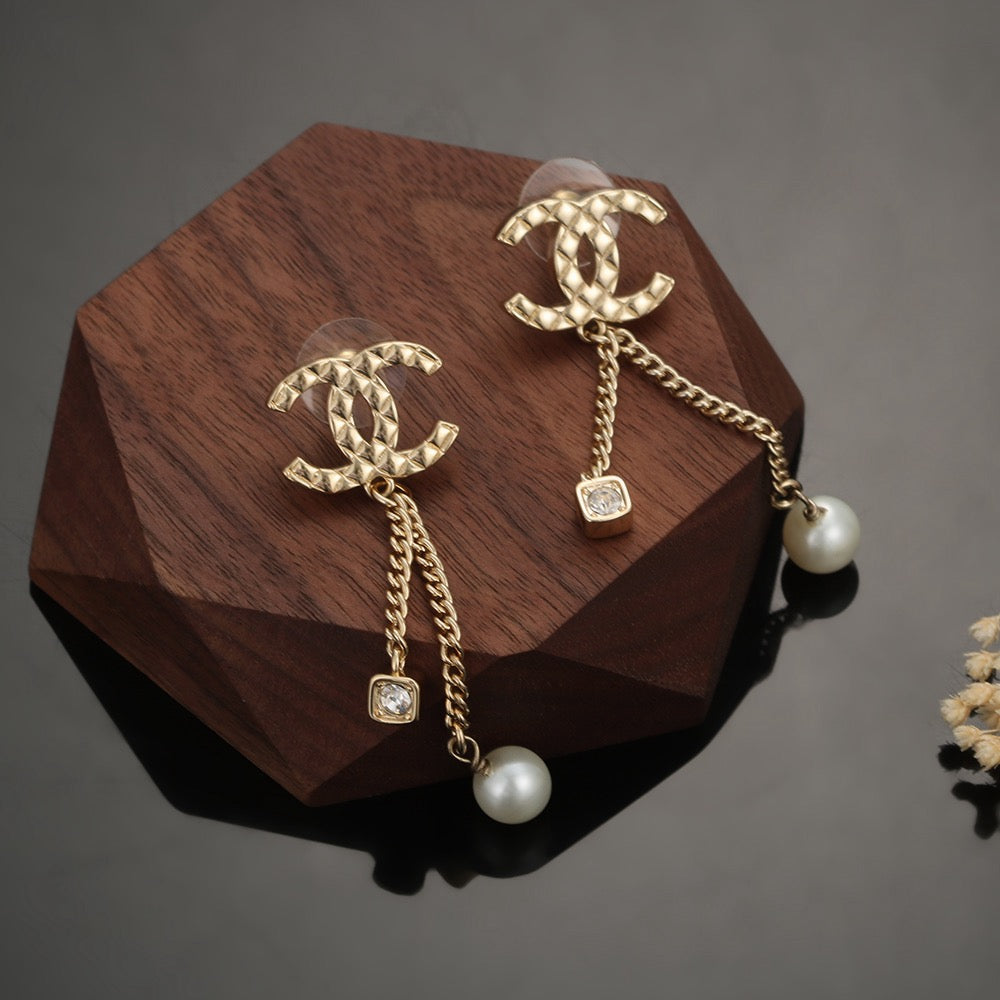 Long gold stud earrings