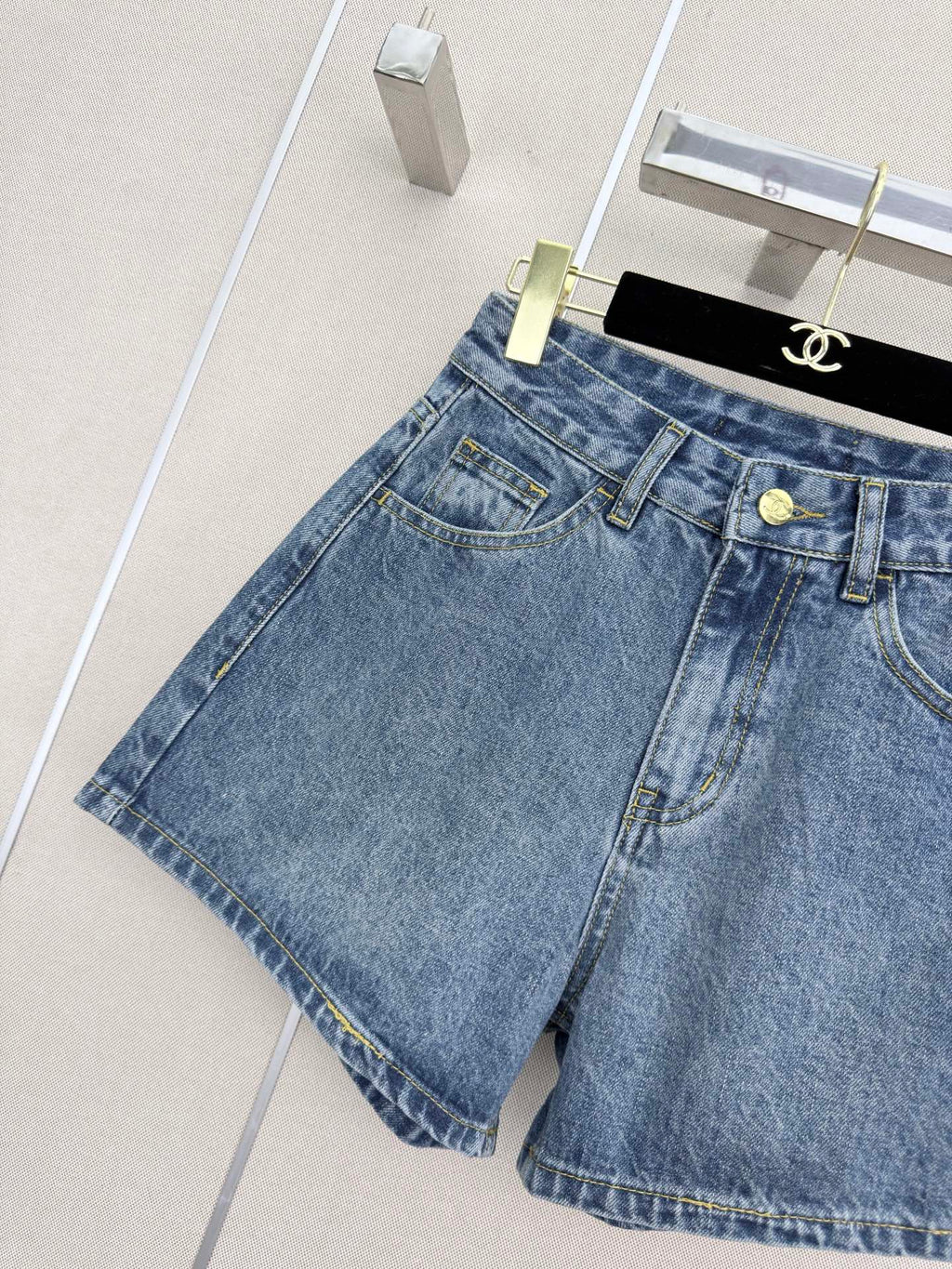 26 New style denim shorts with embroidered pockets