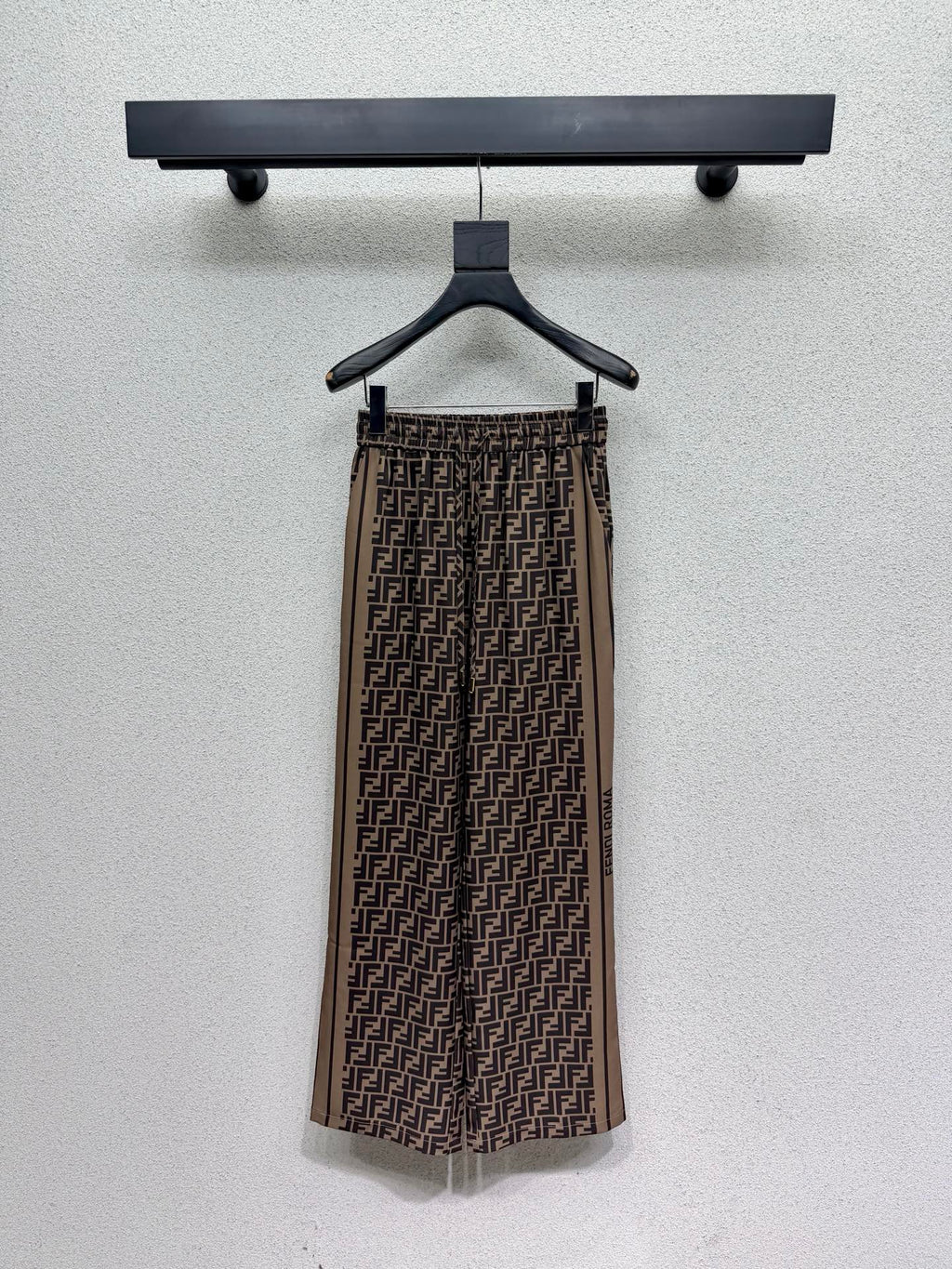 Brown elastic waist monogram trousers