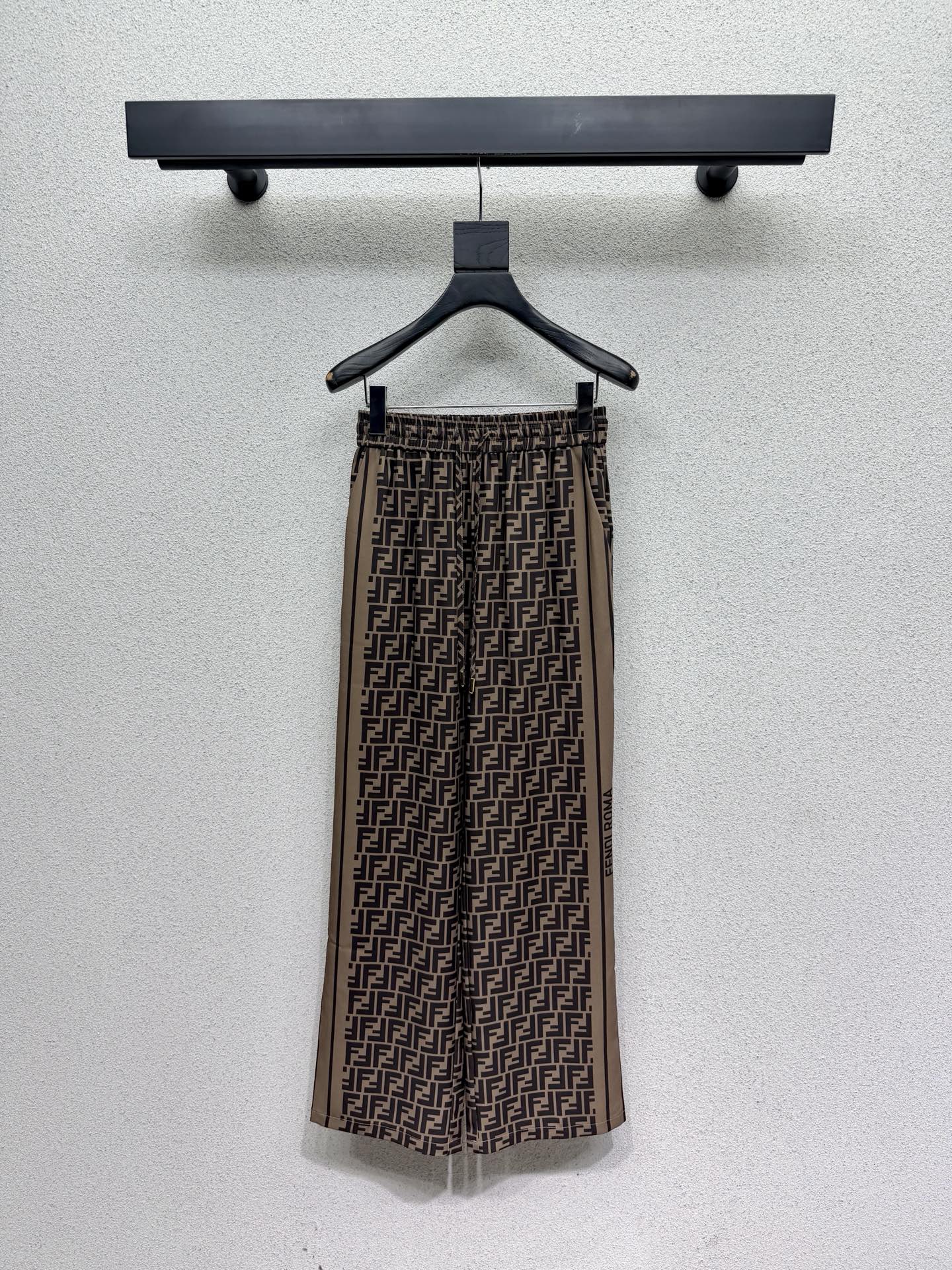 Brown elastic waist monogram trousers