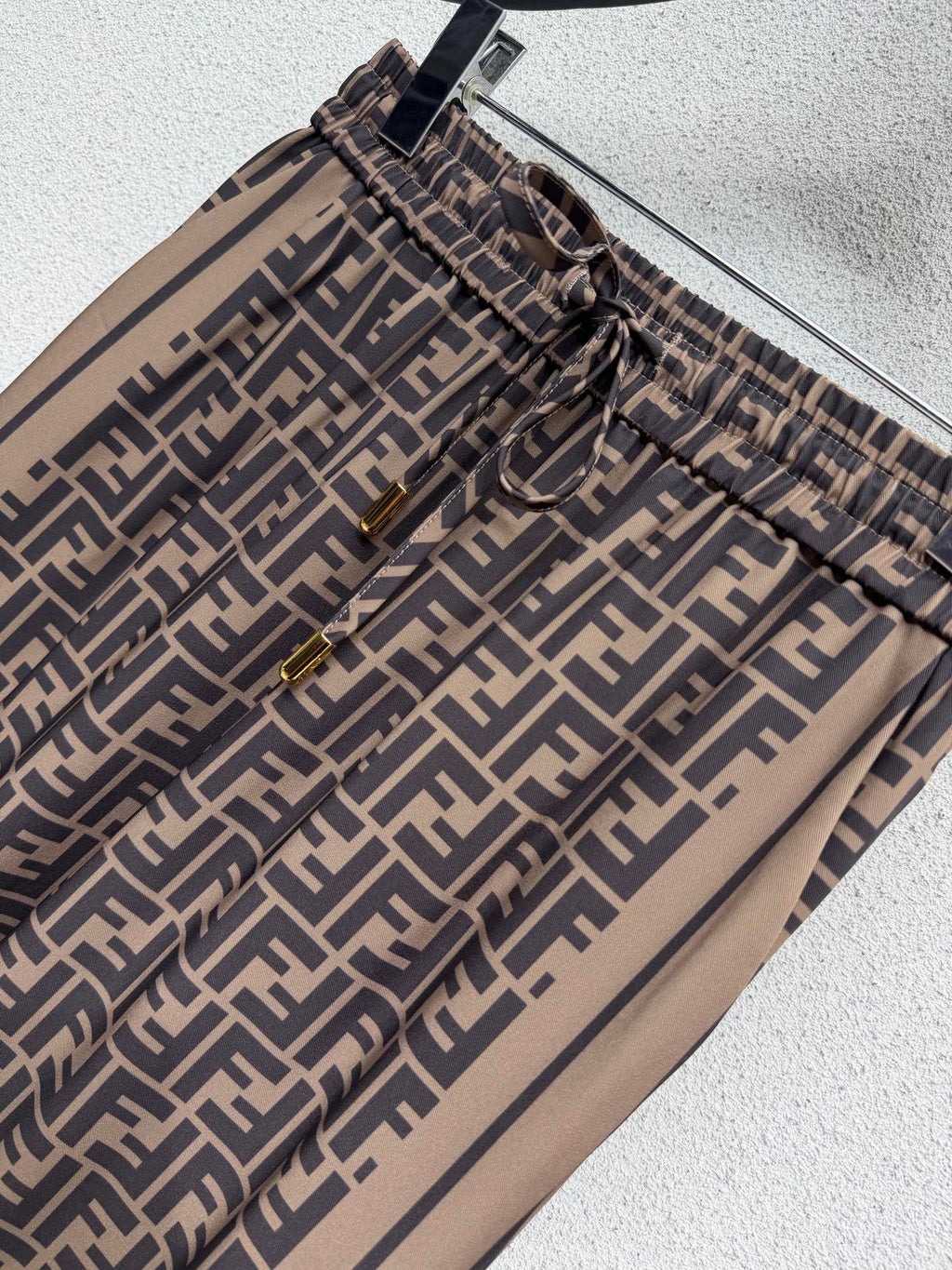Brown elastic waist monogram trousers