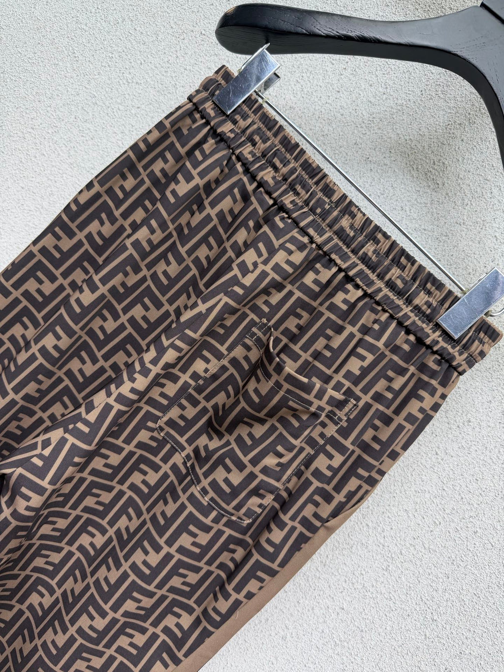 Brown elastic waist monogram trousers