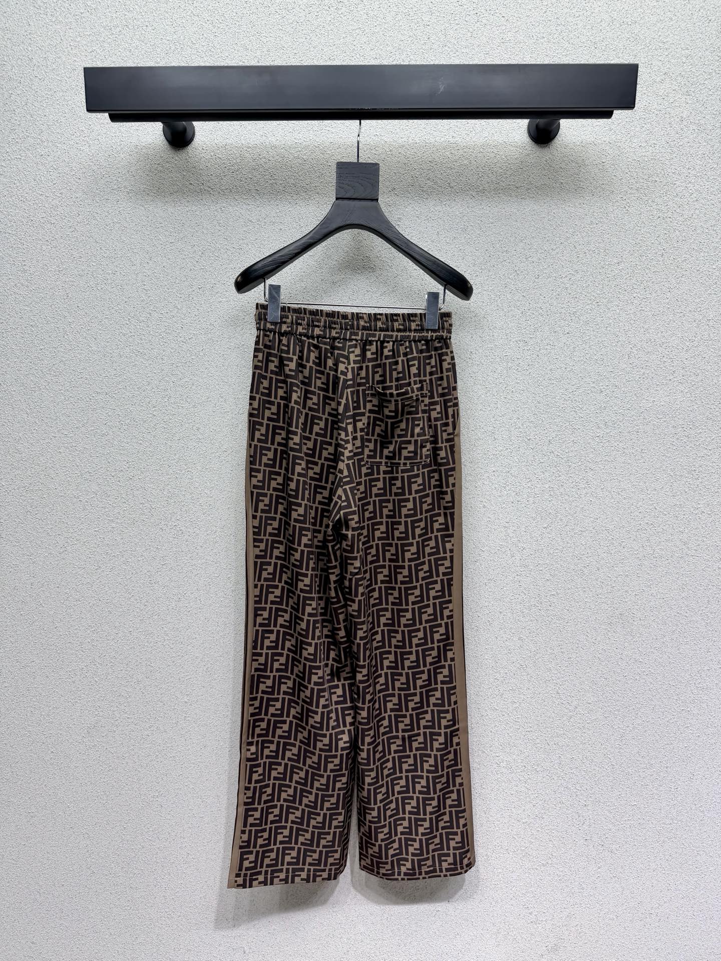 Brown elastic waist monogram trousers