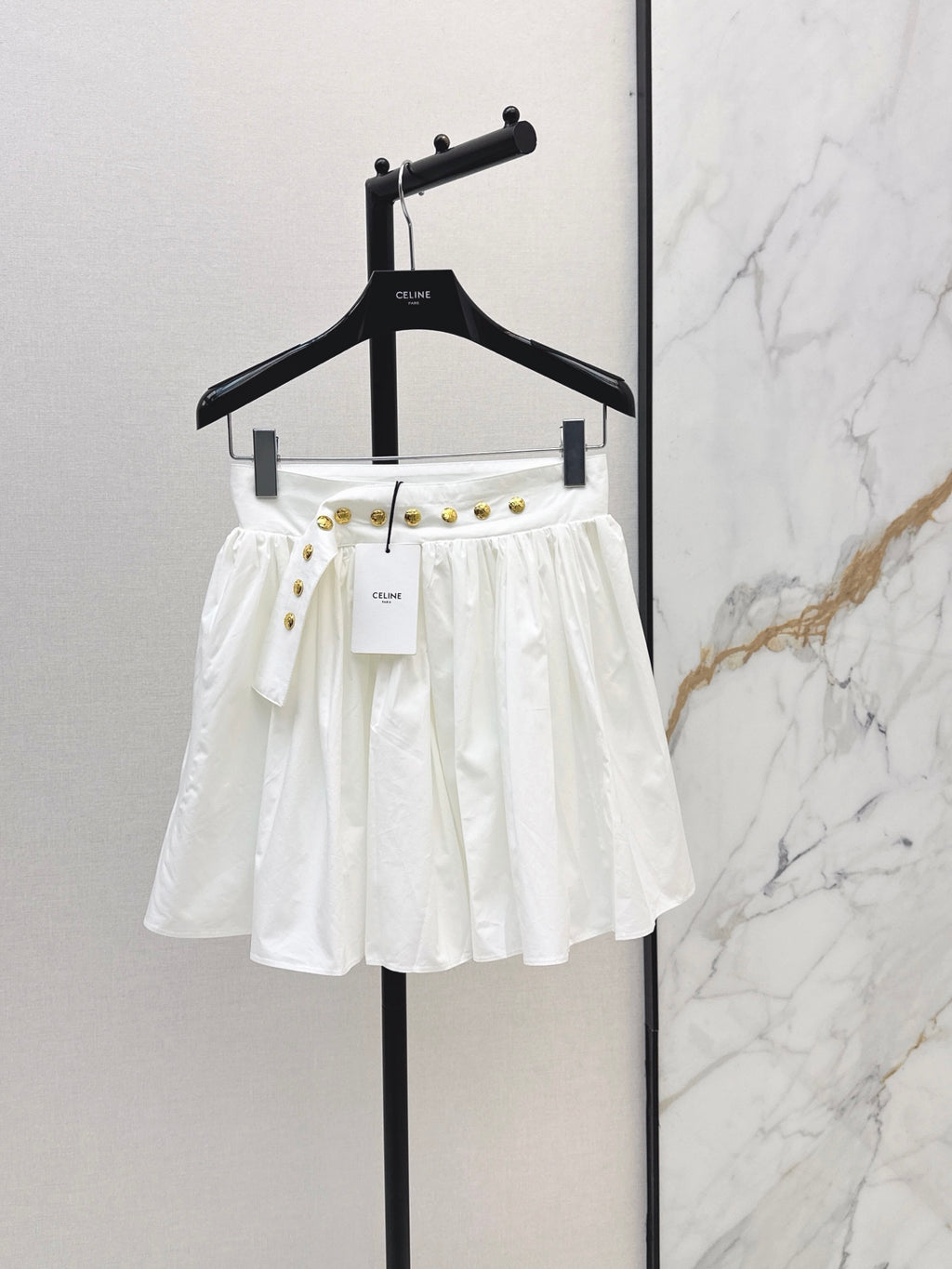26SS — New skirt with gold buckle design