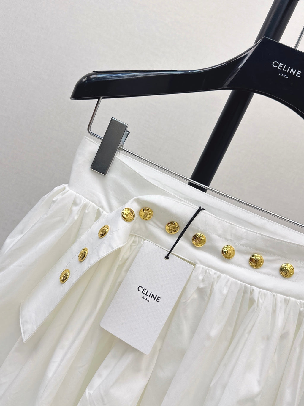 26SS — New skirt with gold buckle design