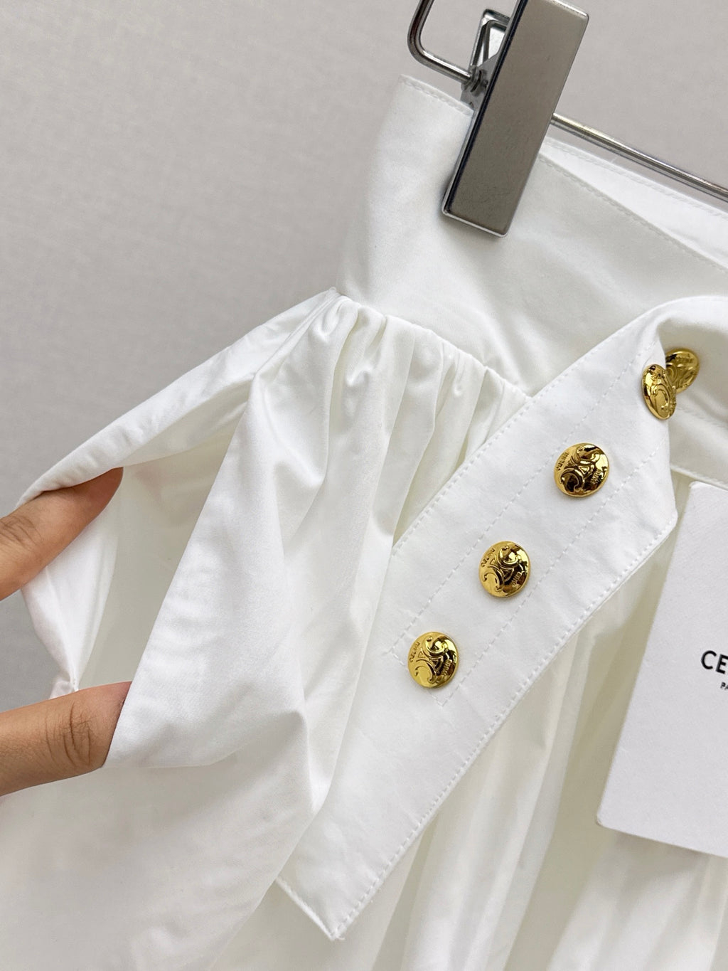 26SS — New skirt with gold buckle design