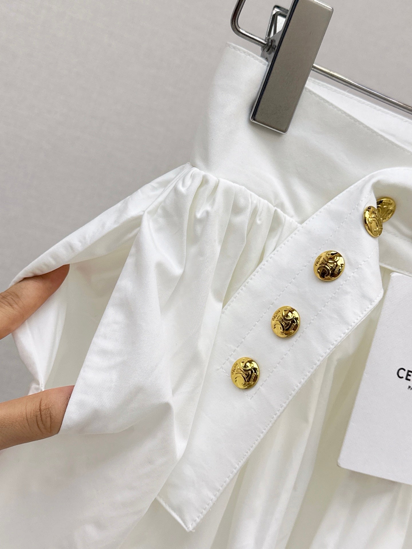 26SS — New skirt with gold buckle design
