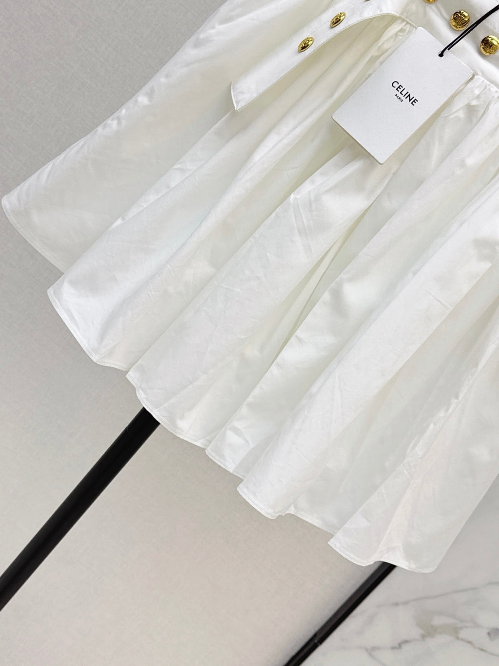 26SS — New skirt with gold buckle design