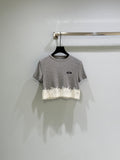 26SS — Delicate lace-trimmed top + short skirt